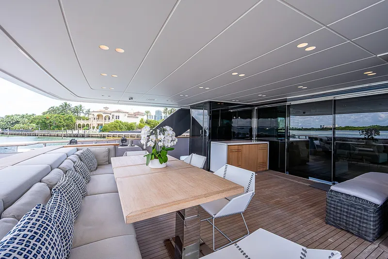 The Wolf Yacht Photos Pics Luxurious 2023 Sanlorenzo SD118 yacht deck with elegant seating and dining area.