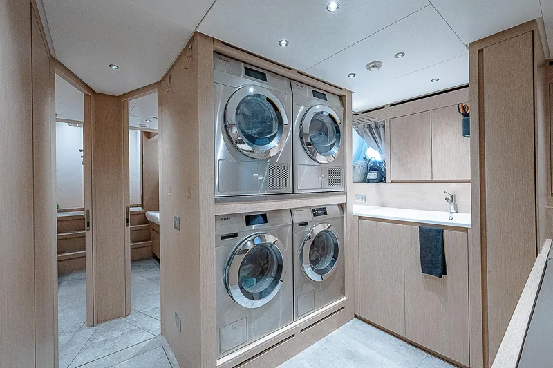 The Wolf Yacht Photos Pics Laundry room on 2023 Sanlorenzo SD118 yacht with modern appliances and sleek design.