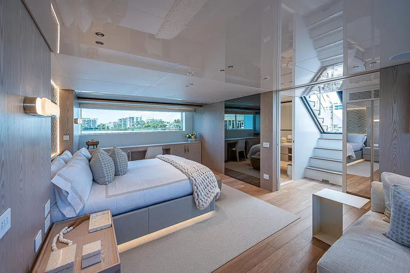 The Wolf Yacht Photos Pics Luxurious 2023 Sanlorenzo SD118 yacht interior with modern bedroom and elegant decor.