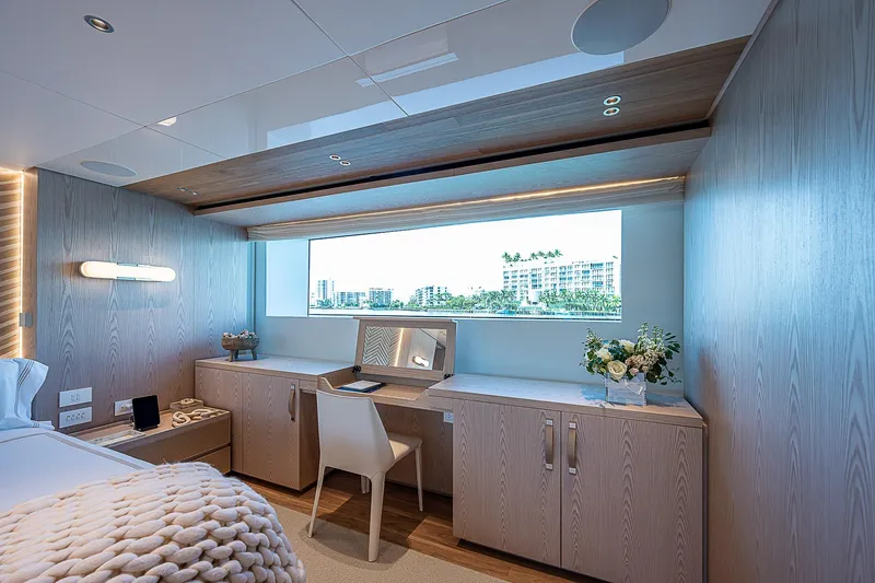The Wolf Yacht Photos Pics Luxurious 2023 Sanlorenzo SD118 yacht cabin with modern decor and large window view.