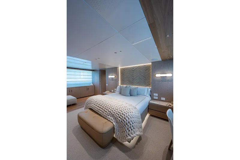 The Wolf Yacht Photos Pics Luxurious bedroom interior of 2023 Sanlorenzo SD118 yacht, featuring modern design and cozy decor.