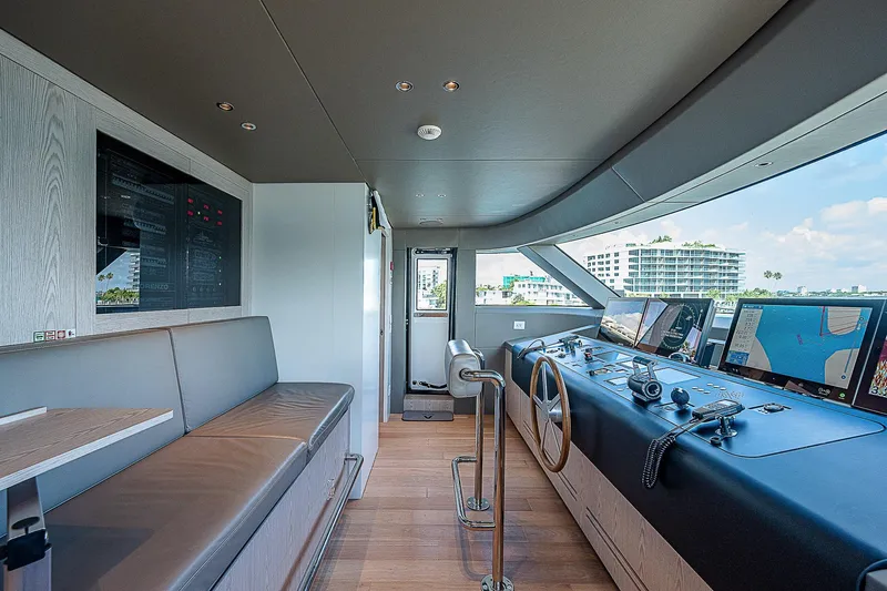 The Wolf Yacht Photos Pics Modern helm station of 2023 Sanlorenzo SD118 yacht with navigation equipment and seating.