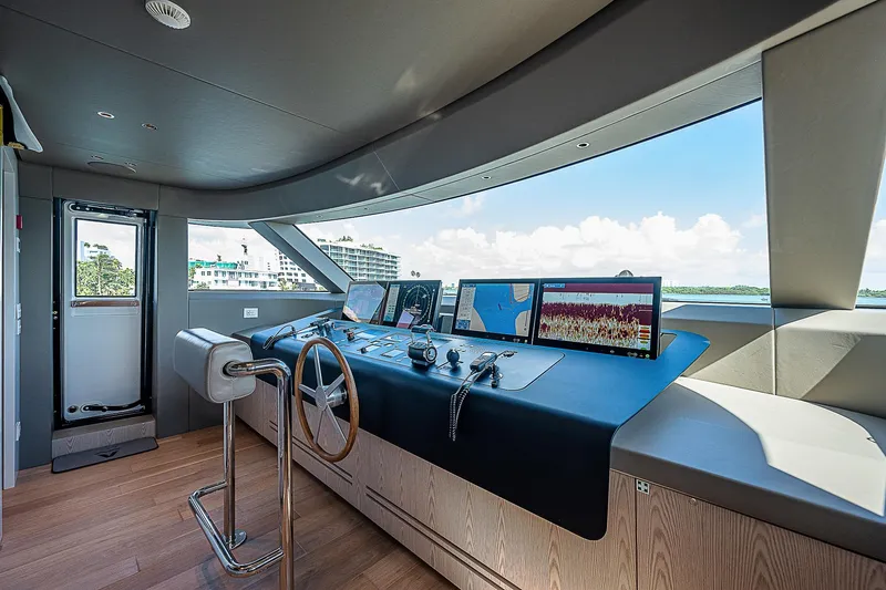 The Wolf Yacht Photos Pics Modern helm station of 2023 Sanlorenzo SD118 yacht with navigation screens and controls.