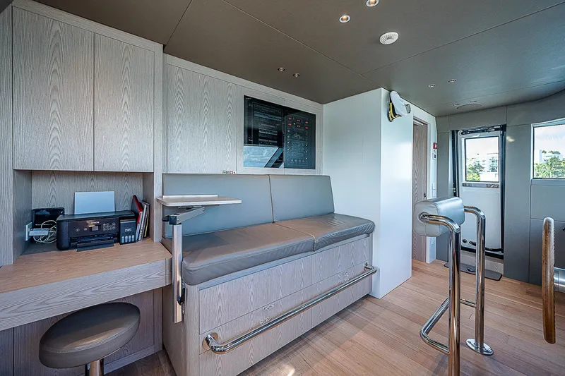 The Wolf Yacht Photos Pics Modern interior of 2023 Sanlorenzo SD118 yacht with sleek seating and control panel.