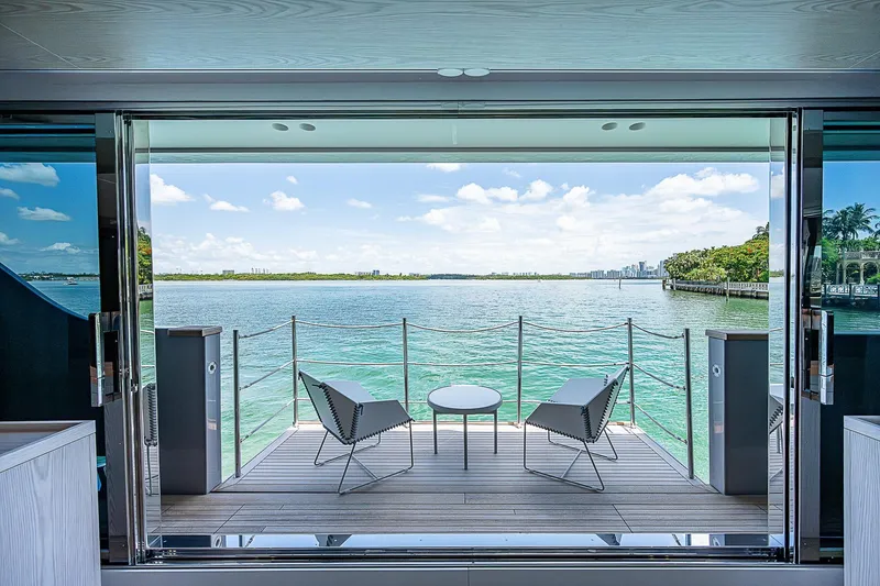 The Wolf Yacht Photos Pics Luxury yacht Sanlorenzo SD118, 2023 model, with elegant deck chairs overlooking serene waters.