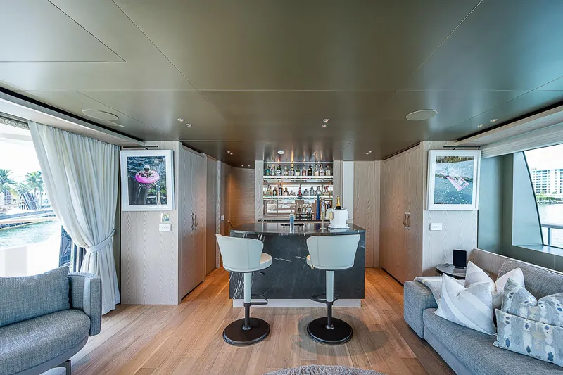 The Wolf Yacht Photos Pics Luxurious interior of 2023 Sanlorenzo SD118 yacht with elegant bar and seating area.