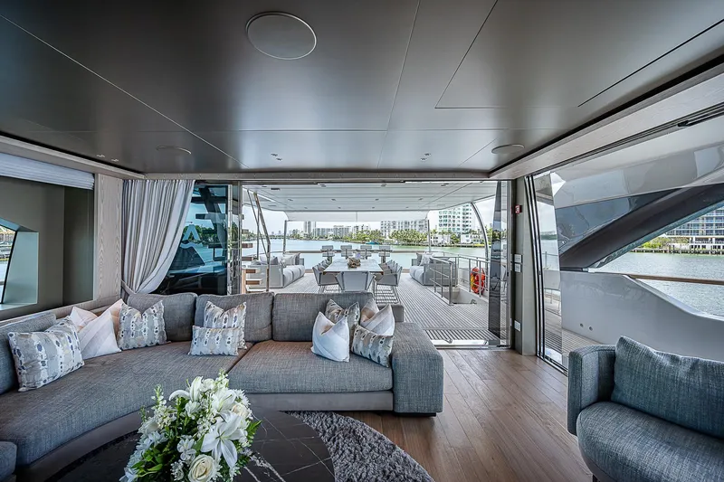 The Wolf Yacht Photos Pics Luxurious interior of 2023 Sanlorenzo SD118 yacht with elegant seating and waterfront view.