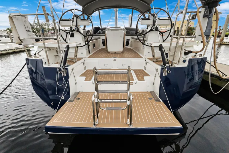 Beatrice Yacht Photos Pics Jeanneau Sun Odyssey 51 Performance 2021 yacht, rear view, docked with open swim platform.