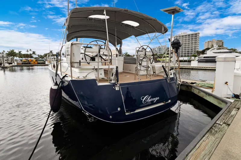 Beatrice Yacht Photos Pics 2021 Jeanneau Sun Odyssey 51 Performance yacht docked at marina, blue hull, clear sky.