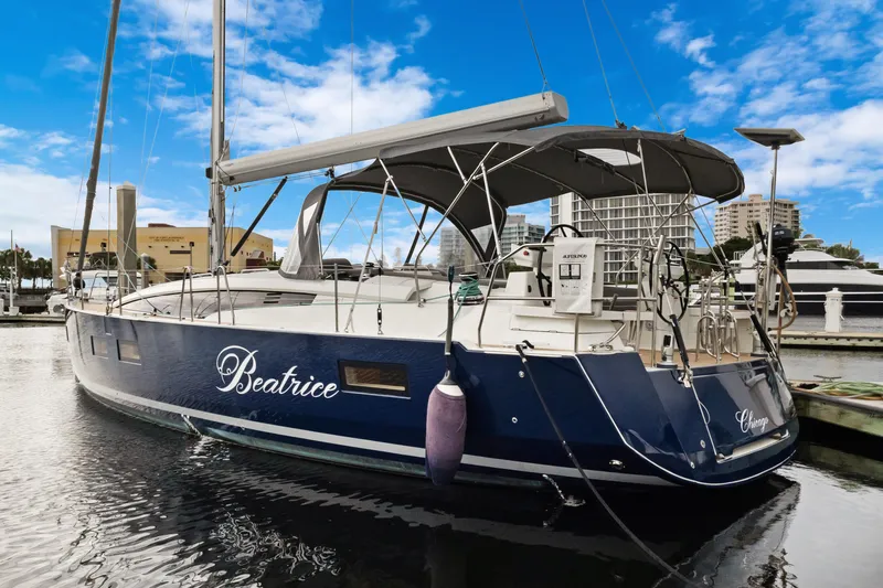 Beatrice Yacht Photos Pics Jeanneau Sun Odyssey 51 Performance yacht docked, 2021 model, with blue hull and canopy.