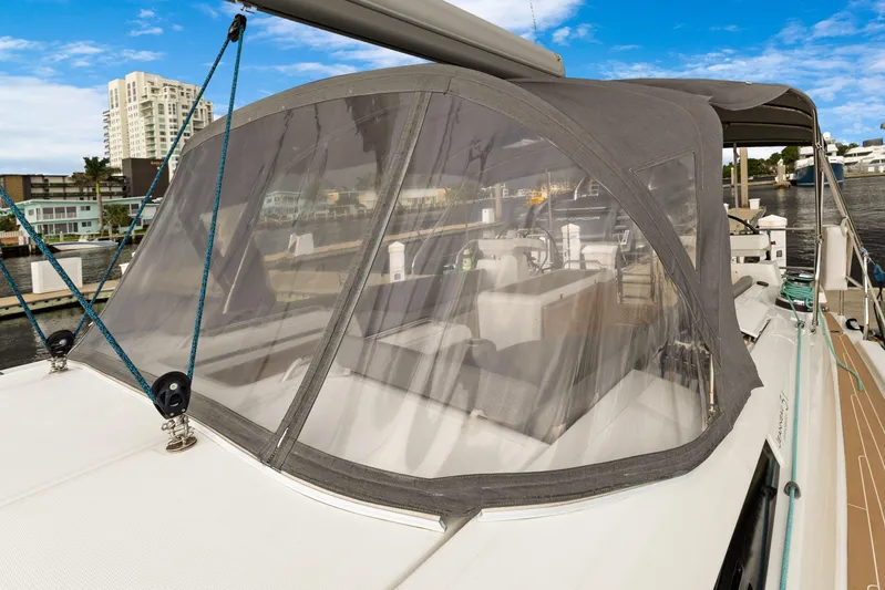 Beatrice Yacht Photos Pics Jeanneau Sun Odyssey 51 Performance yacht, 2021 model, docked with protective canopy.