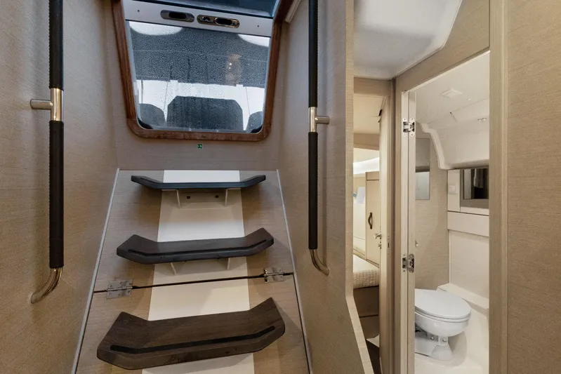 Beatrice Yacht Photos Pics Interior of 2021 Jeanneau Sun Odyssey 51 Performance yacht, featuring stairs and bathroom.