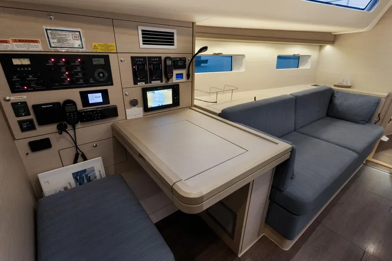 Beatrice Yacht Photos Pics Modern interior of 2021 Jeanneau Sun Odyssey 51 Performance yacht with navigation station.