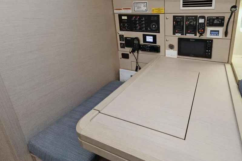 Beatrice Yacht Photos Pics Navigation station of 2021 Jeanneau Sun Odyssey 51 Performance yacht, featuring control panels and seating.