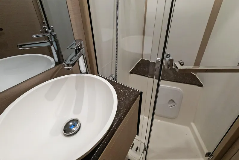 Beatrice Yacht Photos Pics Modern bathroom interior on 2021 Jeanneau Sun Odyssey 51 Performance yacht.