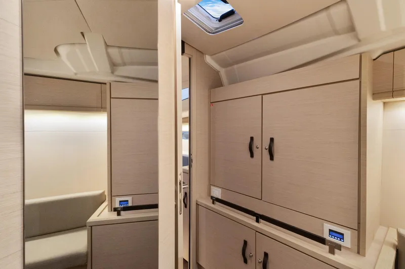 Beatrice Yacht Photos Pics Interior of 2021 Jeanneau Sun Odyssey 51 Performance yacht, featuring modern cabinetry and seating.