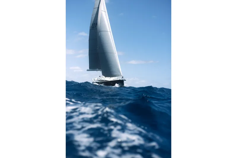 Beatrice Yacht Photos Pics 2021 Jeanneau Sun Odyssey 51 Performance sailing on open ocean under clear blue sky.