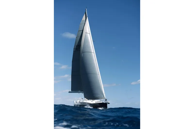 Beatrice Yacht Photos Pics Jeanneau Sun Odyssey 51 Performance sailing on open sea under clear blue sky.