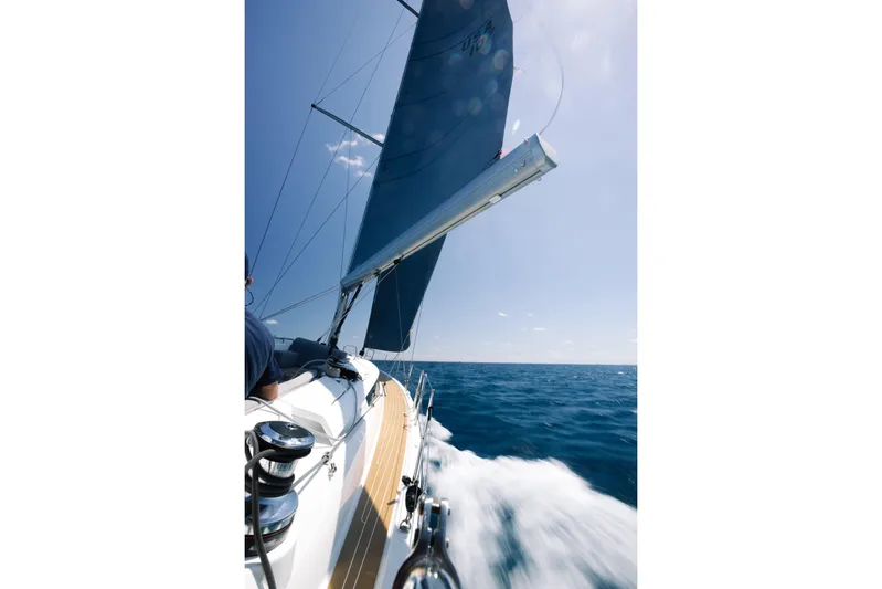 Beatrice Yacht Photos Pics Sailing Jeanneau Sun Odyssey 51 Performance, 2021 model, on open sea under clear blue sky.