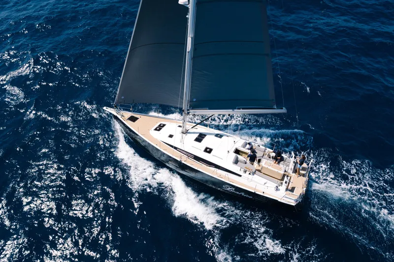 Beatrice Yacht Photos Pics Aerial view of 2021 Jeanneau Sun Odyssey 51 Performance sailing on open sea.