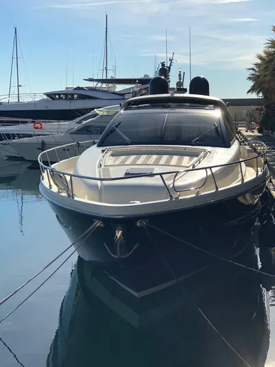  Yacht Photos Pics Luxury 2006 Riva Super Ego 68 yacht docked in a marina.