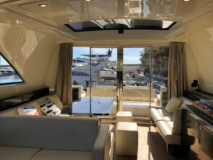  Yacht Photos Pics Luxurious interior of 2006 Riva Super Ego 68 yacht with marina view.