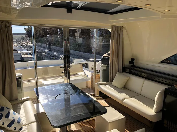  Yacht Photos Pics Luxurious interior of 2006 Riva Super Ego 68 yacht with elegant seating and table.