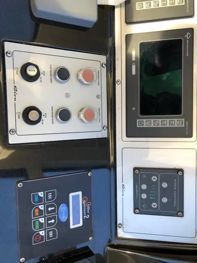  Yacht Photos Pics Control panel of a 2006 Riva Super Ego 68 yacht with various buttons and displays.