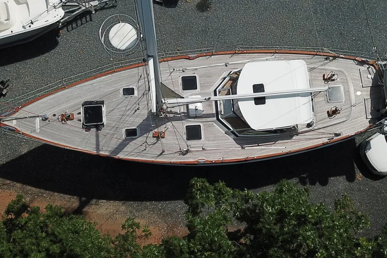 Pegasus Yacht Photos Pics Aerial view of 1984 Hallberg-Rassy 49 sailboat on land, showcasing deck and mast.