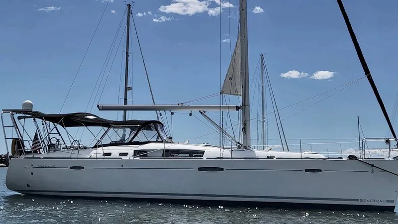Rob Roy Yacht Photos Pics 2008 Beneteau Oceanis 46 sailboat on calm water under clear blue sky.