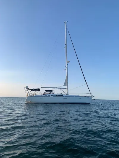 Rob Roy Yacht Photos Pics 2008 Beneteau Oceanis 46 sailboat on calm sea under clear blue sky.