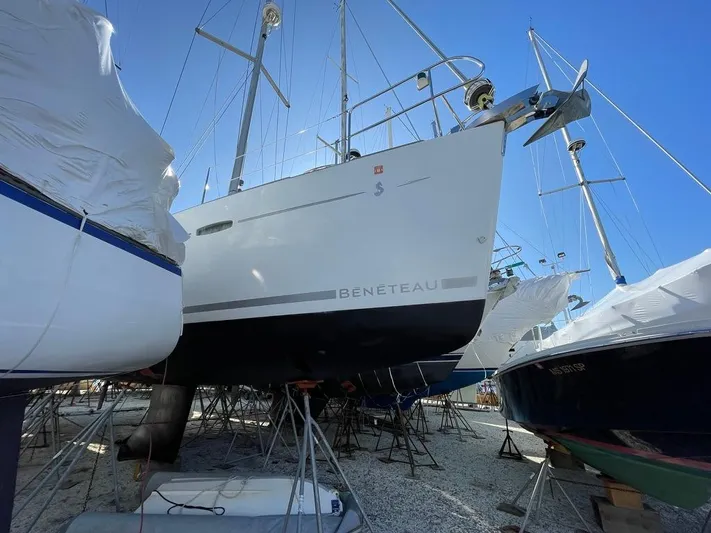 Rob Roy Yacht Photos Pics Beneteau Oceanis 46 sailboat, 2008 model, in dry dock under clear blue sky.