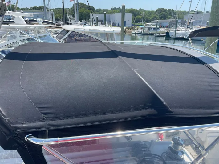 Rob Roy Yacht Photos Pics Black canopy on a 2008 Beneteau Oceanis 46 sailboat, docked at a marina.