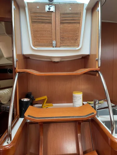 Rob Roy Yacht Photos Pics Interior of 2008 Beneteau Oceanis 46 sailboat with wooden steps and storage.
