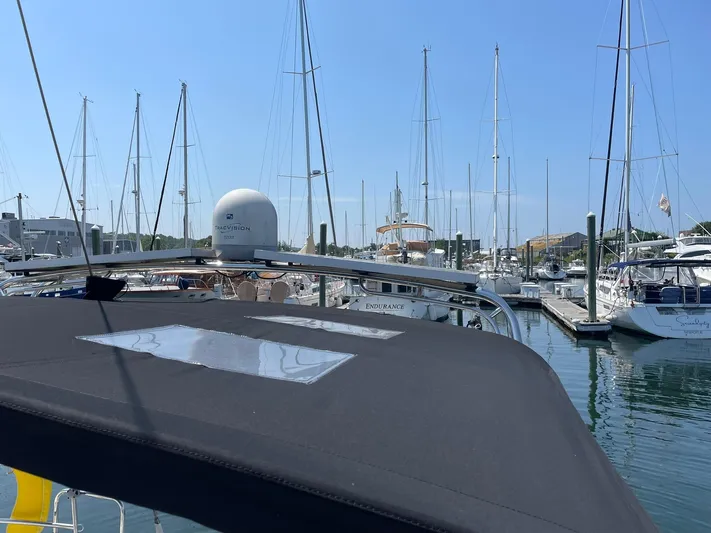 Rob Roy Yacht Photos Pics Beneteau Oceanis 46 sailboat docked in a marina, surrounded by other boats, under clear blue sky.