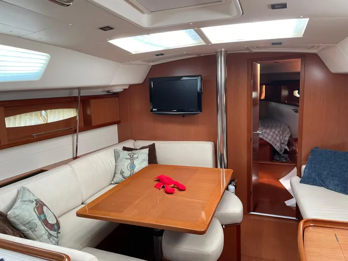 Rob Roy Yacht Photos Pics Interior of 2008 Beneteau Oceanis 46 yacht with cozy seating and wooden finishes.