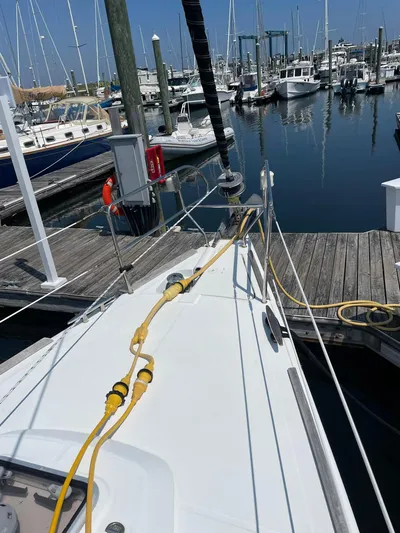 Rob Roy Yacht Photos Pics Beneteau Oceanis 46 sailboat docked at marina, showing deck and mooring lines.
