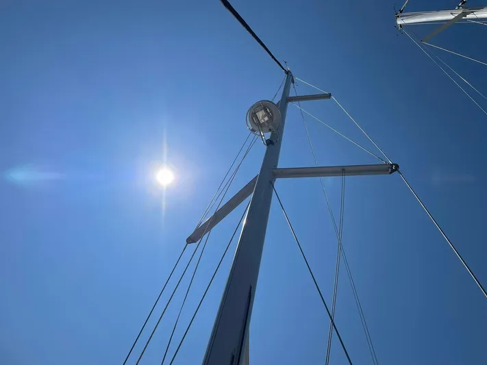Rob Roy Yacht Photos Pics Mast of 2008 Beneteau Oceanis 46 sailboat against clear blue sky and bright sun.