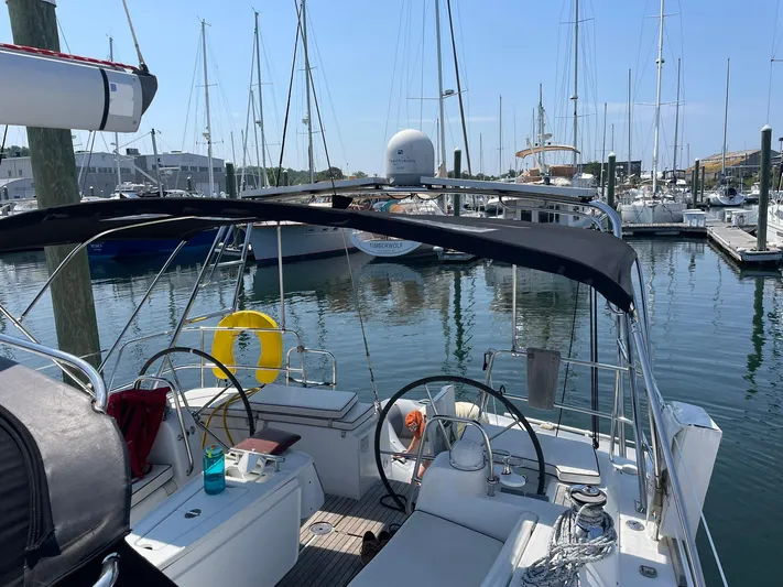 Rob Roy Yacht Photos Pics Beneteau Oceanis 46 sailboat, 2008 model, docked in a marina with clear skies.