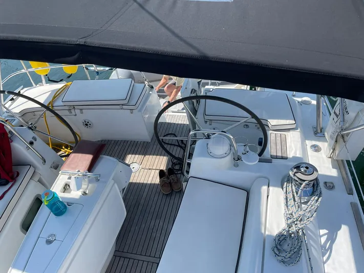 Rob Roy Yacht Photos Pics Cockpit view of 2008 Beneteau Oceanis 46 sailboat with dual steering wheels and deck seating.