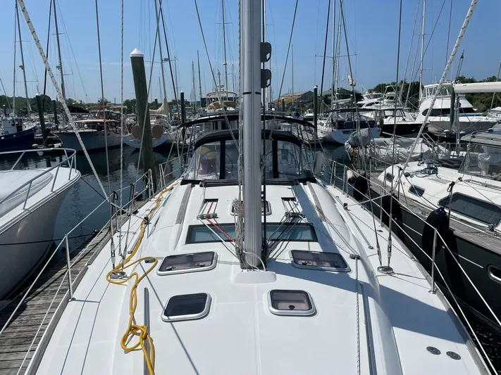 Rob Roy Yacht Photos Pics Sailboat Beneteau Oceanis 46, 2008 model, docked in a marina with clear blue skies.