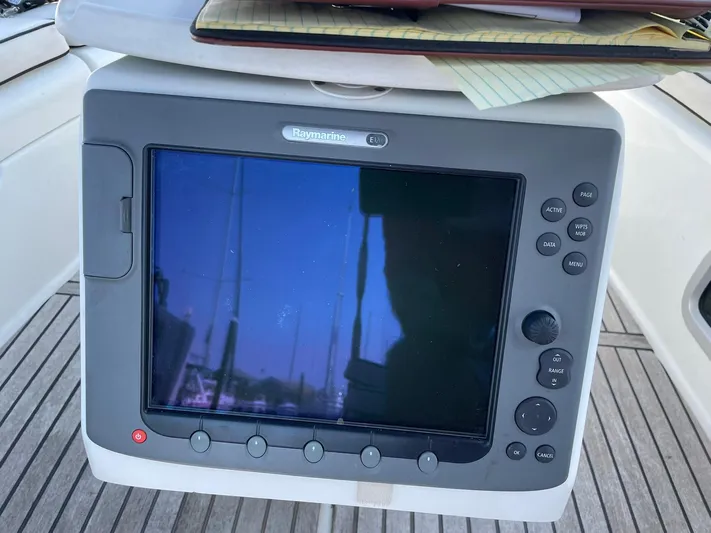 Rob Roy Yacht Photos Pics Raymarine navigation system on 2008 Beneteau Oceanis 46 yacht, with wooden deck background.