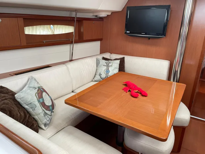 Rob Roy Yacht Photos Pics Interior of 2008 Beneteau Oceanis 46 yacht with cozy seating and decorative pillows.