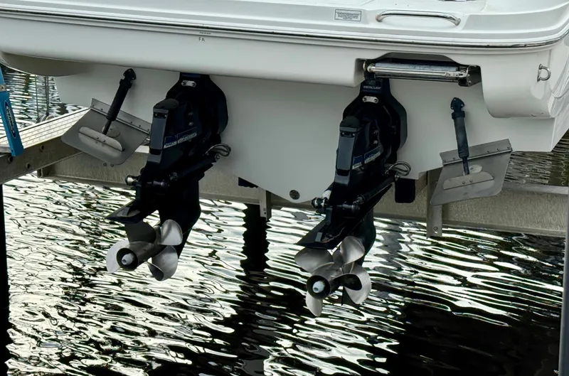 Just Us Yacht Photos Pics 2010 Sea Ray 310 Sundancer boat with dual propellers and trim tabs on water.