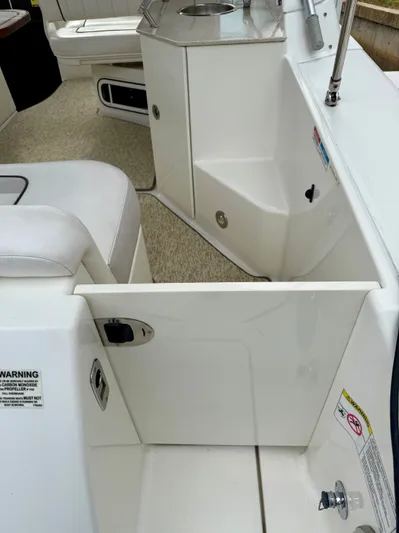 Just Us Yacht Photos Pics 2010 Sea Ray 310 Sundancer interior with seating and kitchenette area.