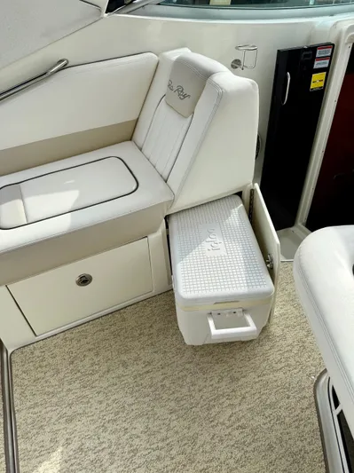 Just Us Yacht Photos Pics Interior of 2010 Sea Ray 310 Sundancer with seating and storage compartment.