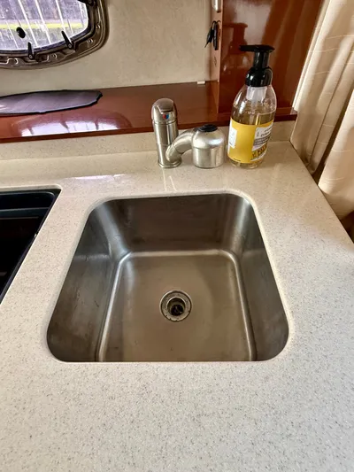 Just Us Yacht Photos Pics Stainless steel sink in 2010 Sea Ray 310 Sundancer yacht kitchen.