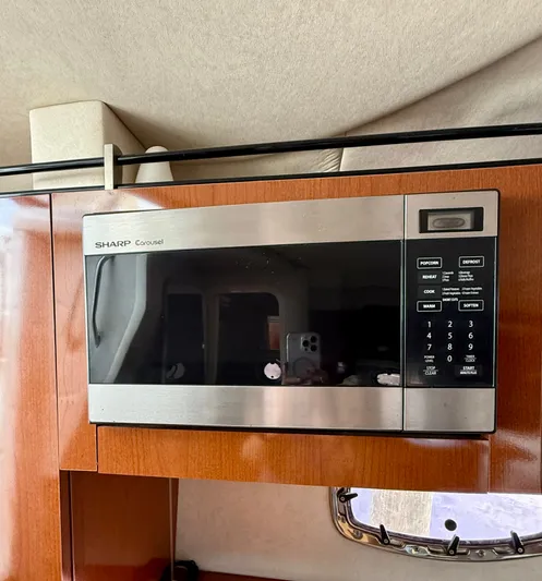 Just Us Yacht Photos Pics Sharp Carousel microwave in 2010 Sea Ray 310 Sundancer yacht kitchen.
