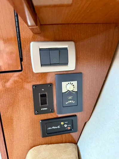 Just Us Yacht Photos Pics Control panel on 2010 Sea Ray 310 Sundancer boat with switches and audio-video inputs.