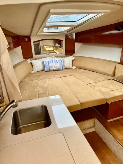 Just Us Yacht Photos Pics Luxurious interior of 2010 Sea Ray 310 Sundancer with cozy seating and skylight.